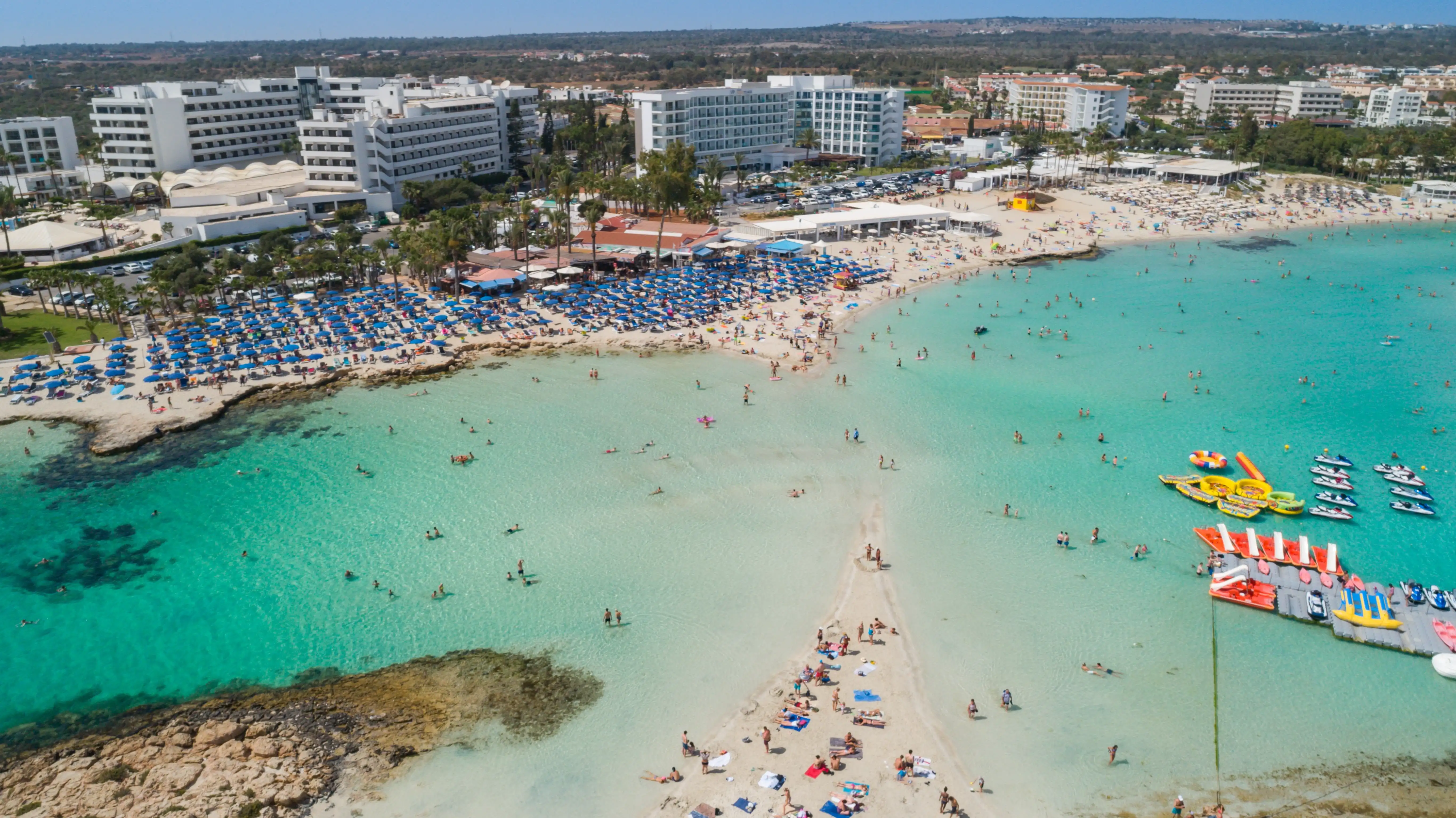 Nissi Beach in Ayia Napa, Cyprus, with white sand and turquoise shallow water