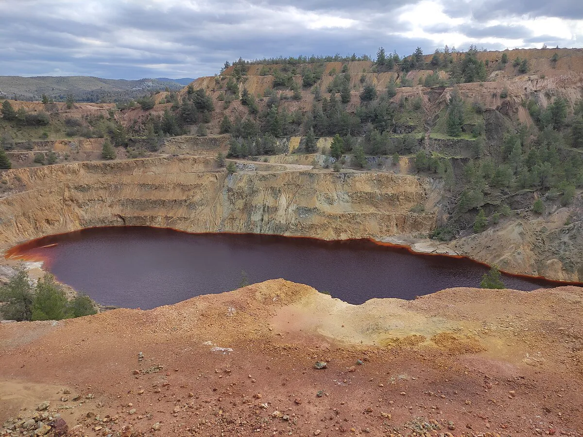 The vivid red lake at the abandoned Mitsero copper mine in Cyprus
