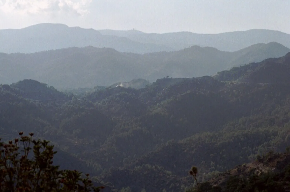 The Troodos mountain range in Cyprus, with pine-forested slopes and rocky peaks